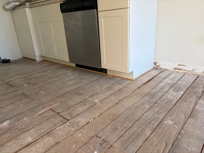 unnamed Kitchen interior demolition showing cabinet and countertop removal in Portland home | demoxterior